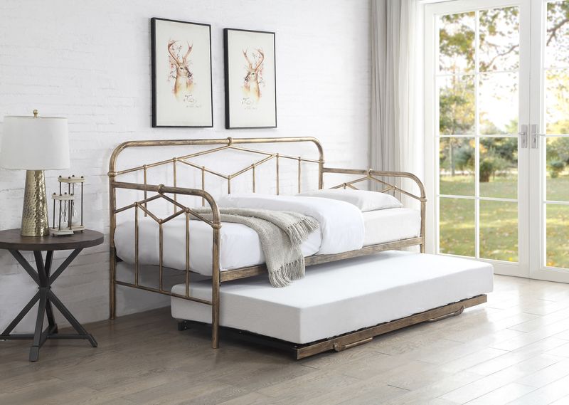 Axton Day Bed in Antique Bronze with pull-out guest bed, showcasing Art Deco geometric design in a bright room setting.