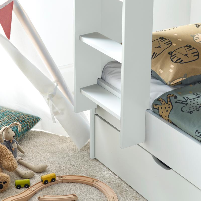 Oliver Bunk Bed with trundle, storage drawers, and shelves in a kid's room setup.