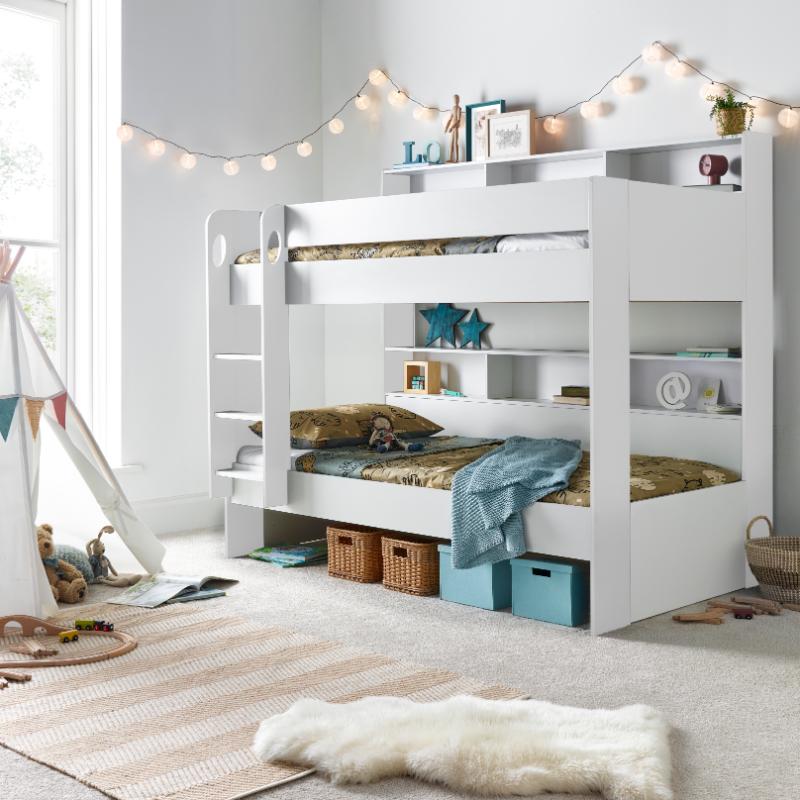 Oliver Bunk Bed with storage, ladder, and pull-out trundle in a cozy kid's bedroom setting.