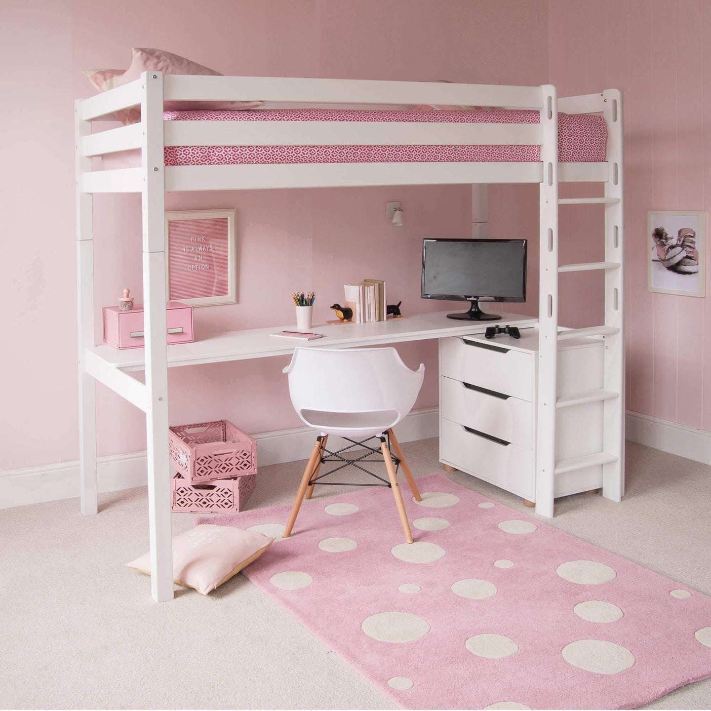 Classic Beech high sleeper bed with wide desk and optional storage, featuring reversible ladder, pink bedding, and drawers in pink-themed room.