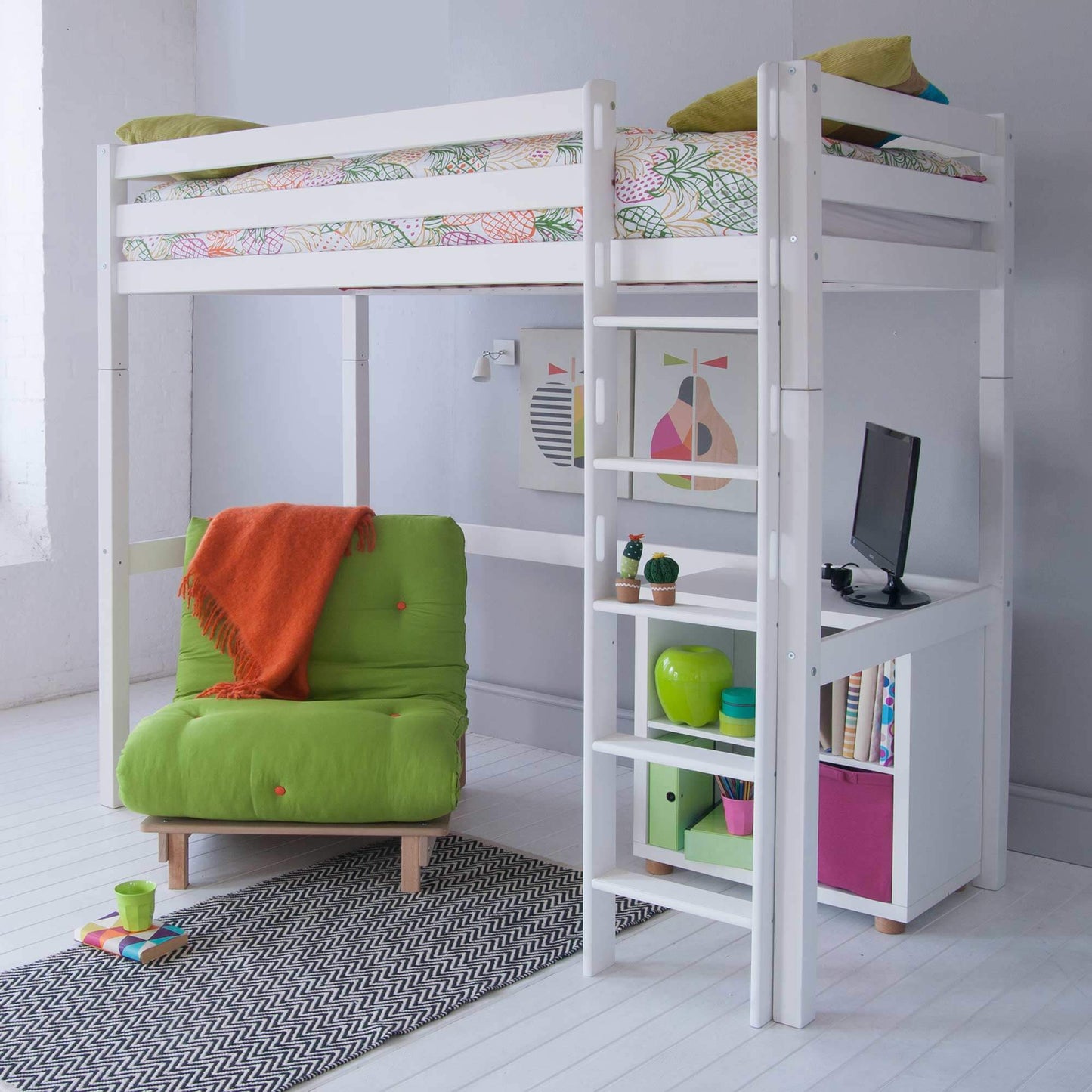 Classic beech high sleeper bed with green futon, desk, and bookshelf in a modern white room.