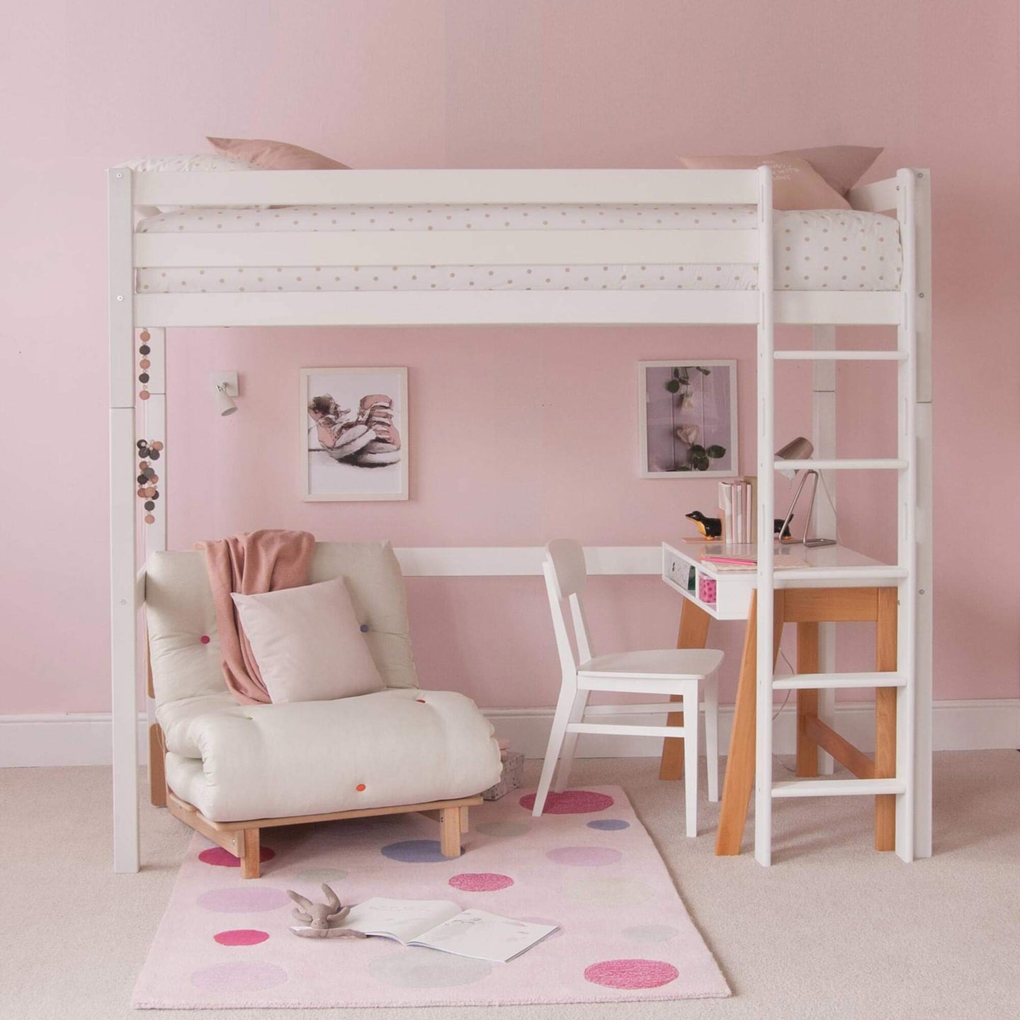 Classic beech high sleeper bed with futon, desk, and ladder in pink bedroom setting.