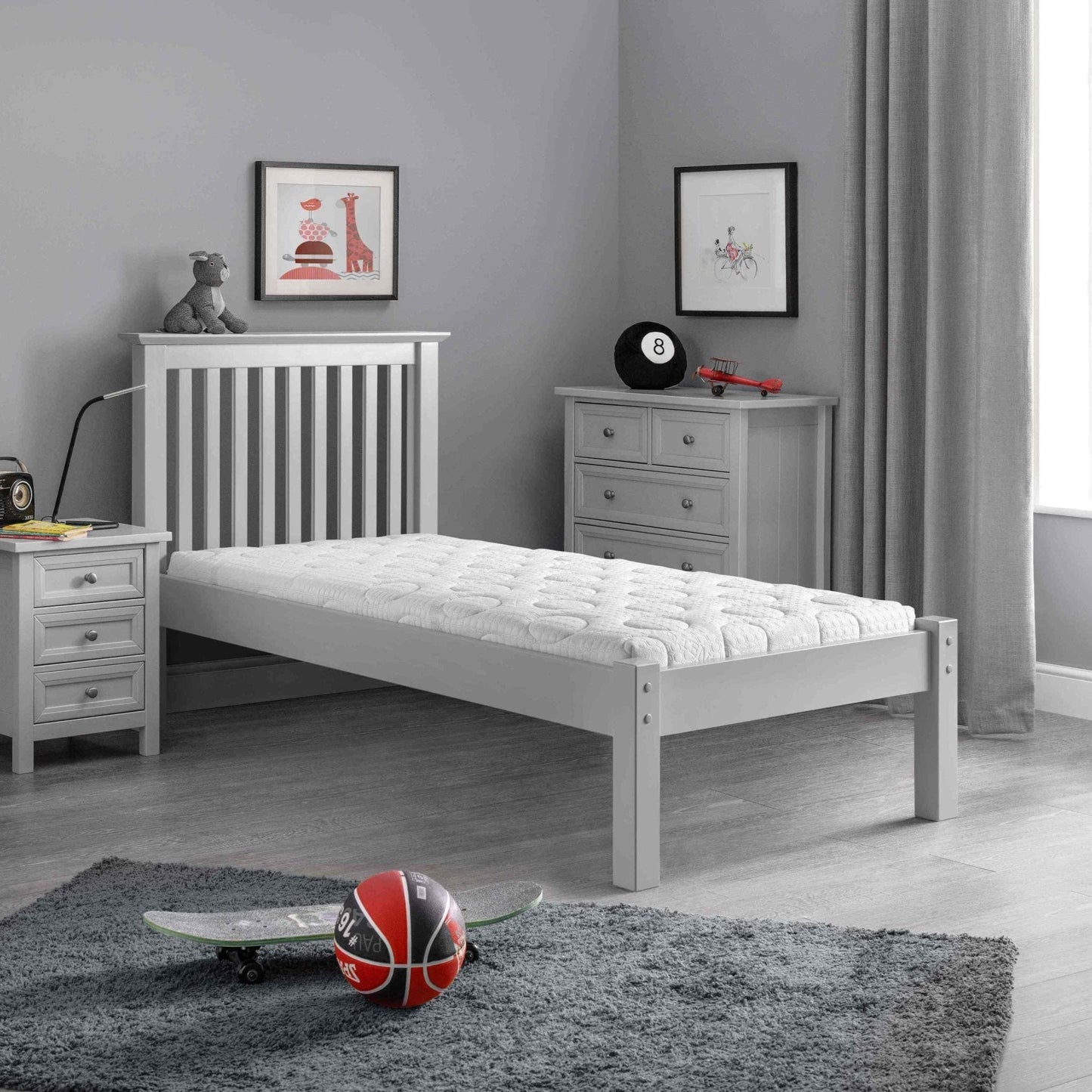 Child's bedroom featuring the Julian Bowen Capsule Reflex Roll-up Mattress on a single bed, highlighting its breathable luxury quilted cover and medium density reflex foam.