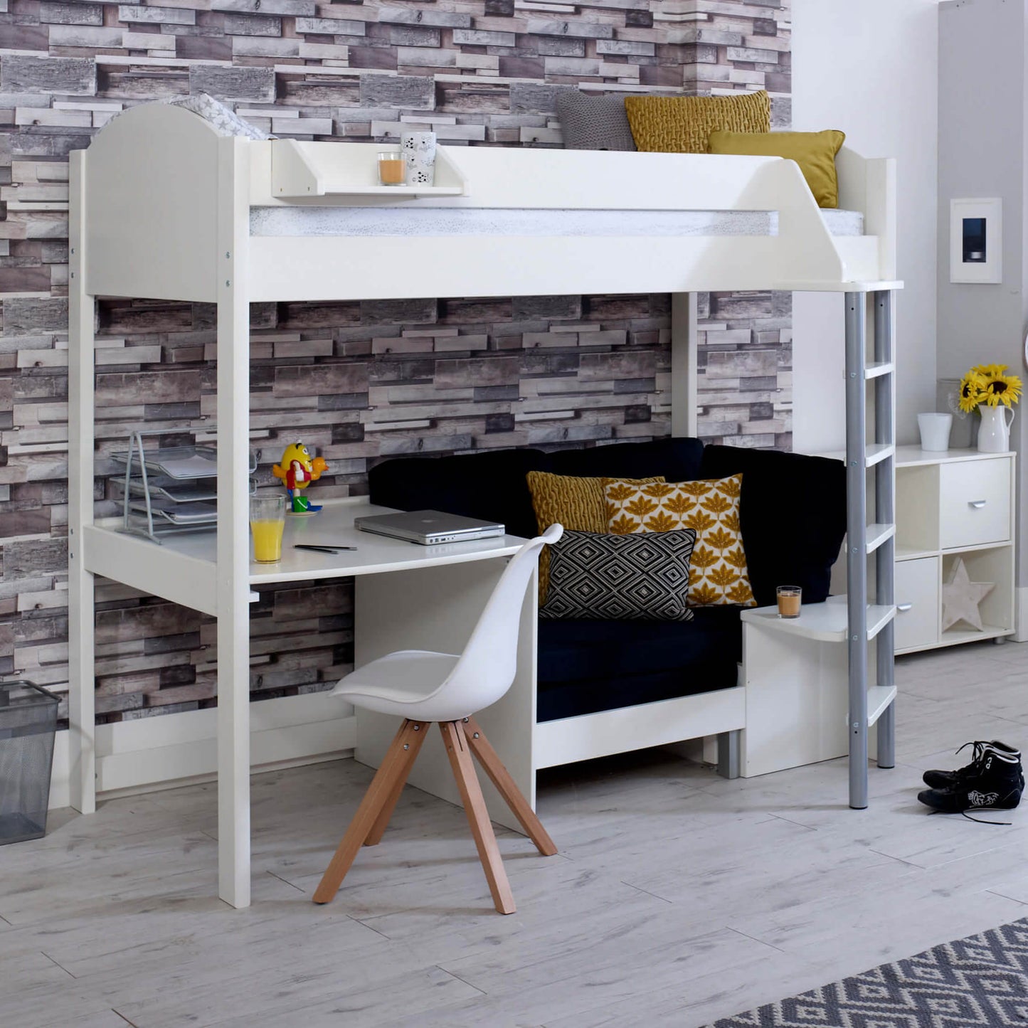 Noah high sleeper loft bed with chair bed, desk, and shelves in a room setting.