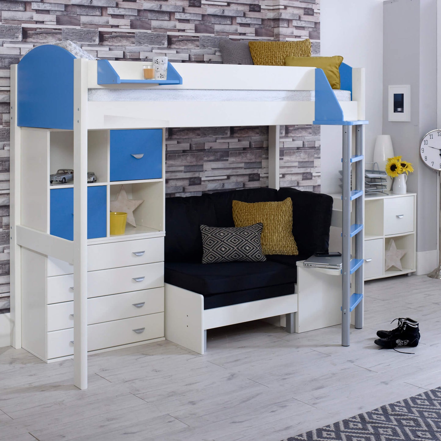 Noah high sleeper loft bed with futon chair bed, storage drawers, and cube storage in a child's bedroom.