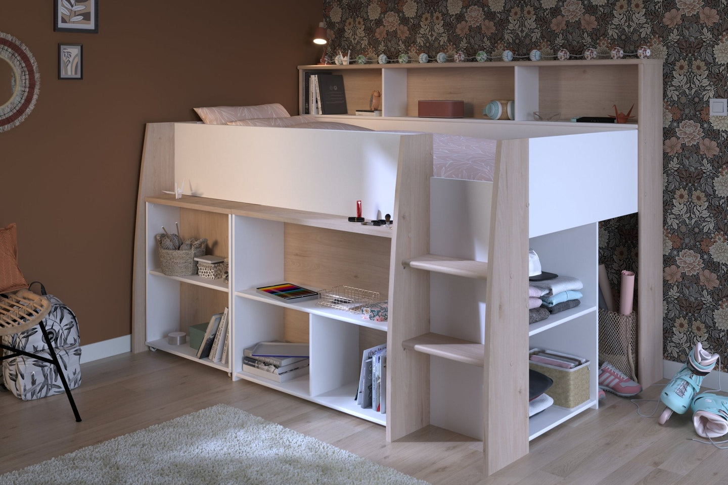 Lucas Midsleeper bed with pull-out desk, storage, and integrated shelf in white and Japanese Oak finish.