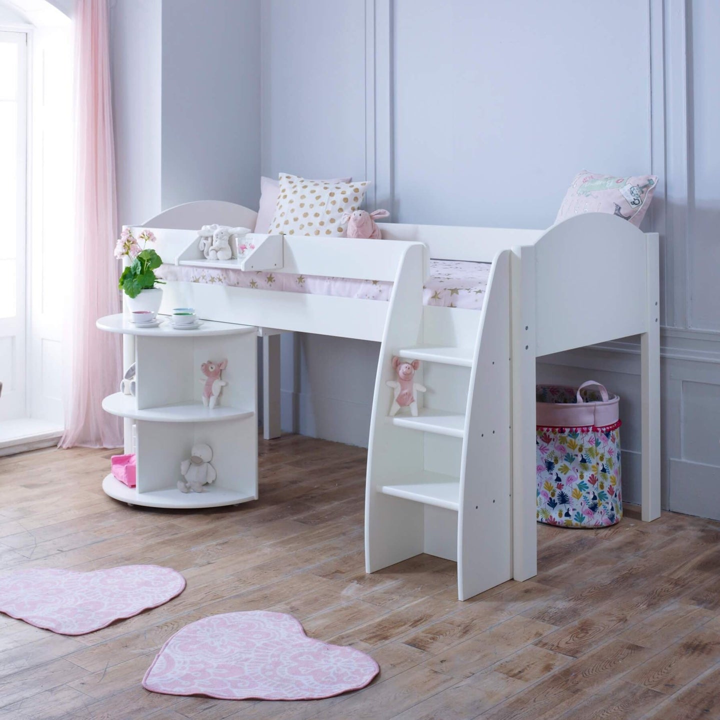 Mid Sleeper Bed with pull out desk, integrated shelves, and storage in a child's room.