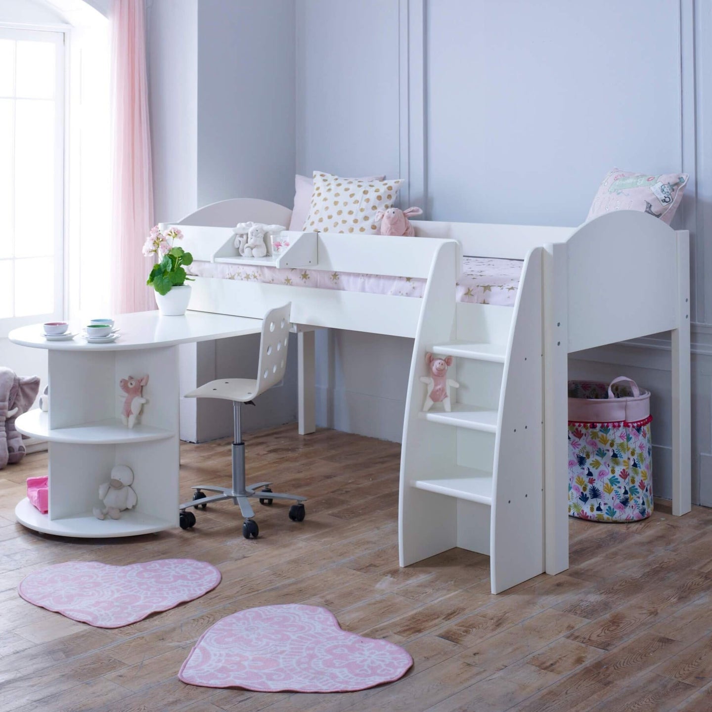 Mid Sleeper Bed with pull out desk, storage shelves, and ladder in a children's room.