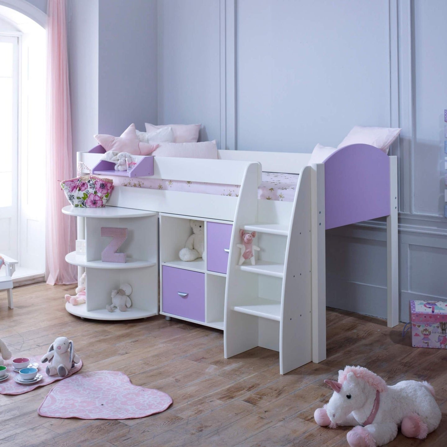 Mid Sleeper Bed with pull-out desk, storage shelves, and ladder in a child's room.