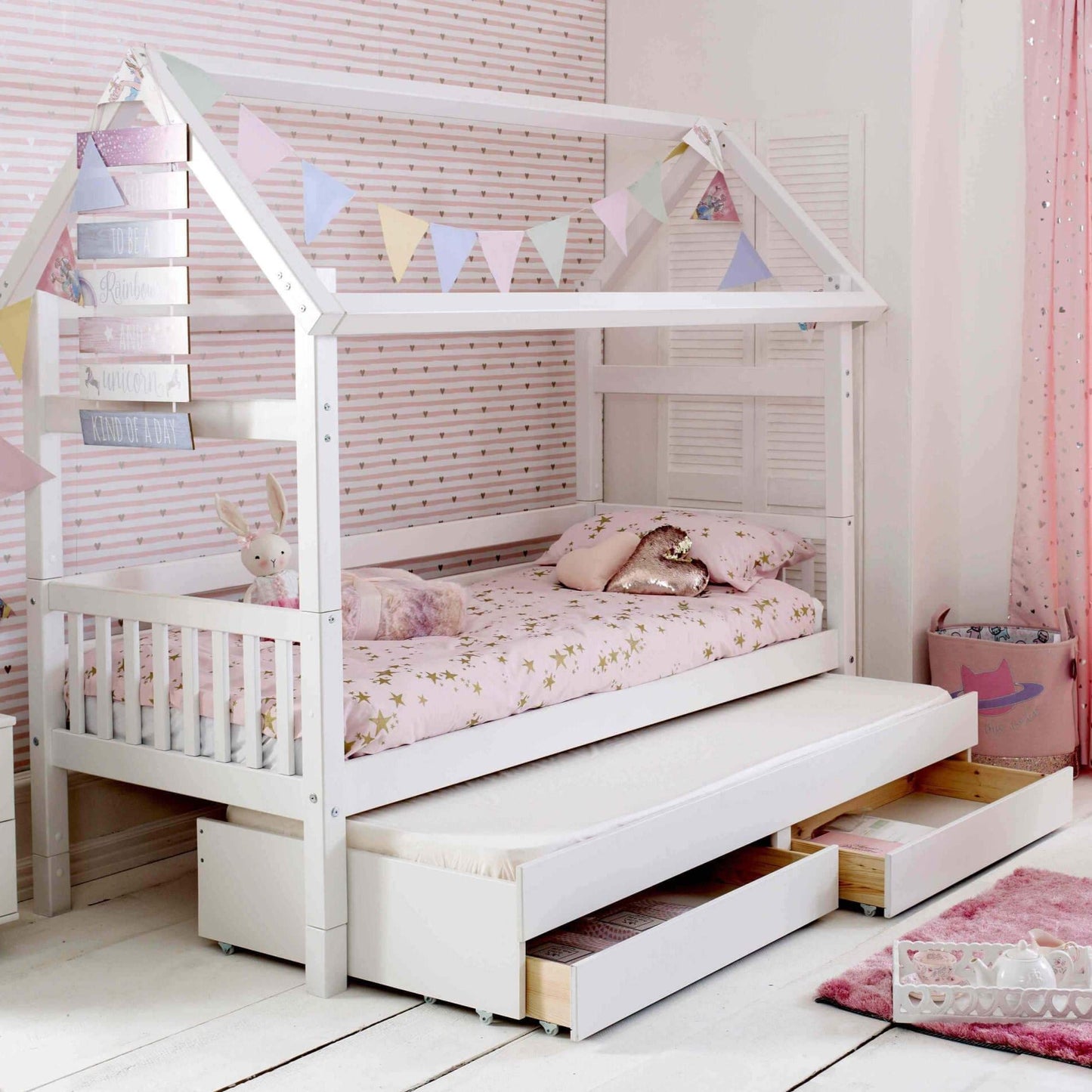 Nordic Playhouse Bed with trundle and storage drawers for kids.