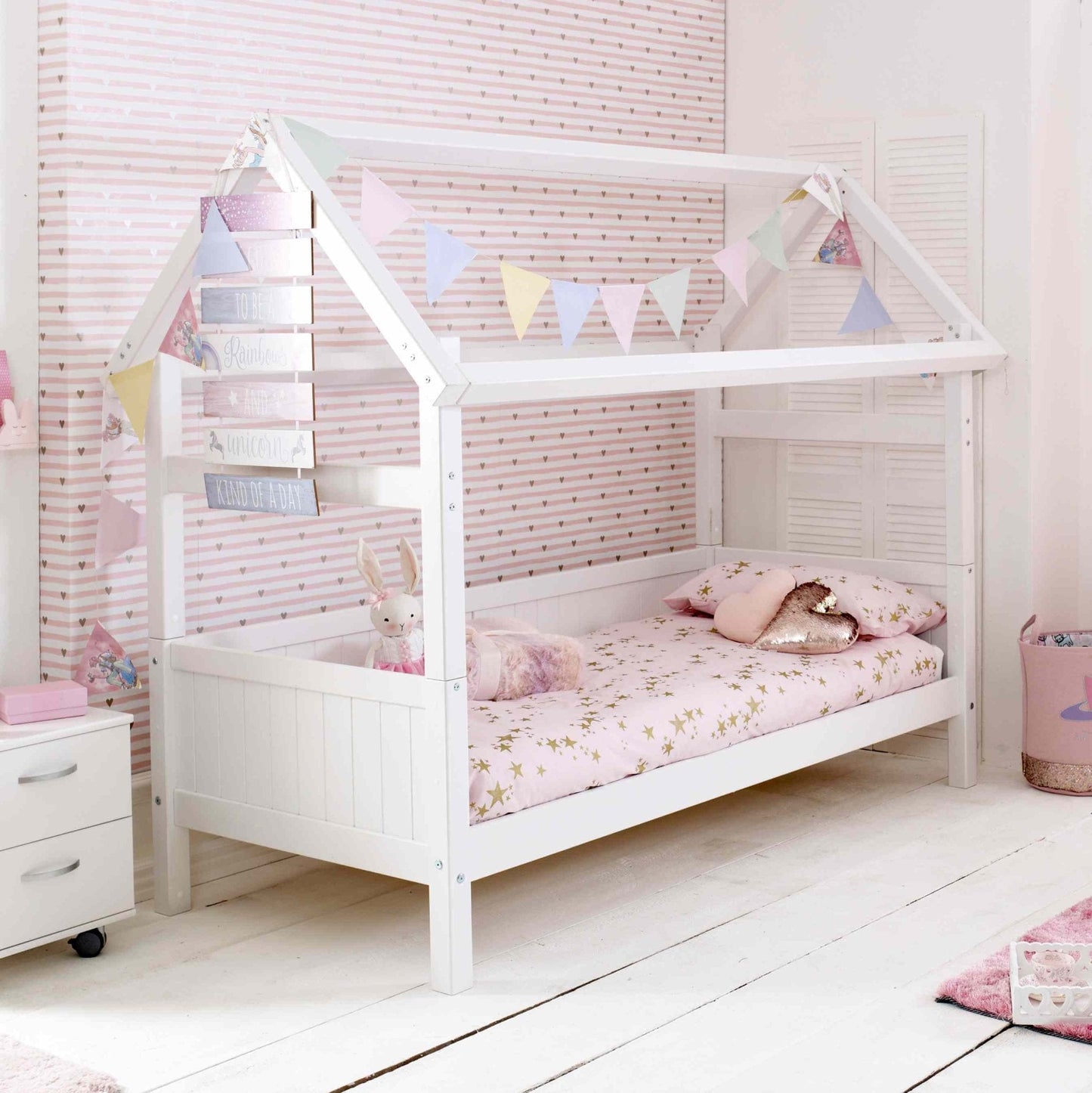 Nordic playhouse bed with optional trundle and storage drawers, white Scandinavian pine, kids' room.