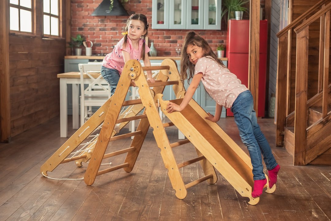 Children playing on a Pikler Montessori Climber Ladder Slide indoors.