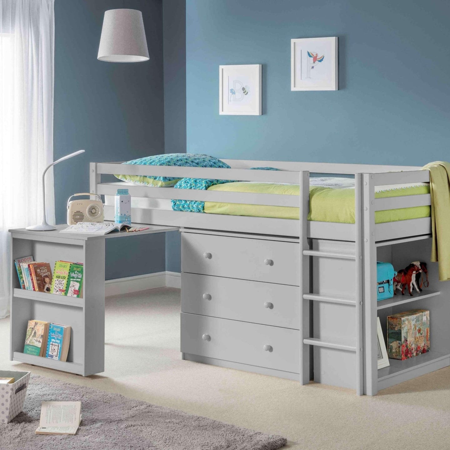 Roxy Sleepstation Mid Sleeper Bed with desk, storage drawers, shelves, and ladder in a children's bedroom.