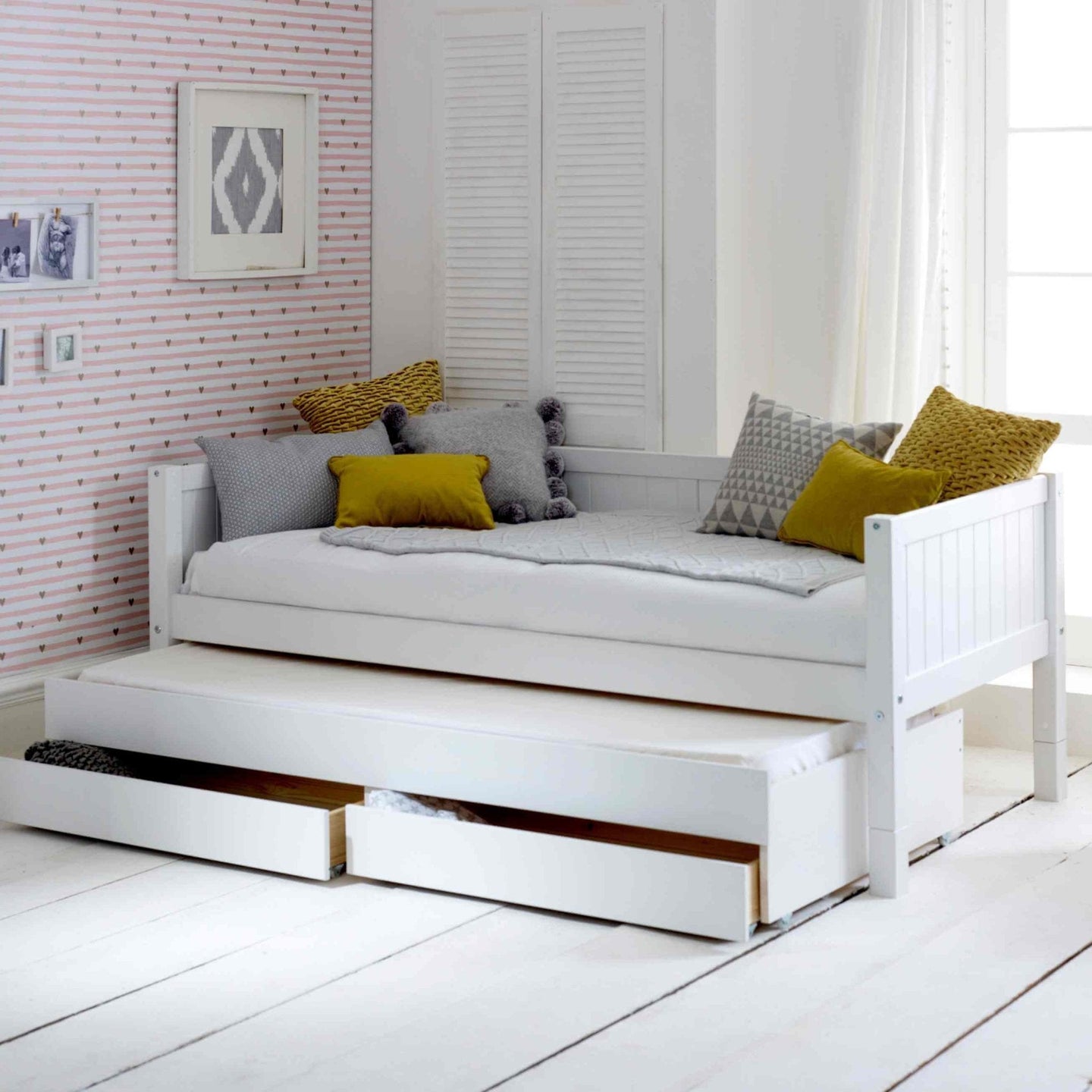 Nordic daybed with trundle pull-out bed and storage drawers, ideal for guest room or kids.