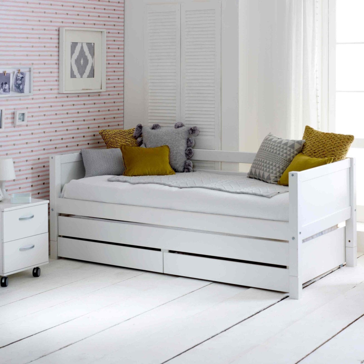 The Nordic Daybed with trundle pull out and storage drawers in a stylish white finish.