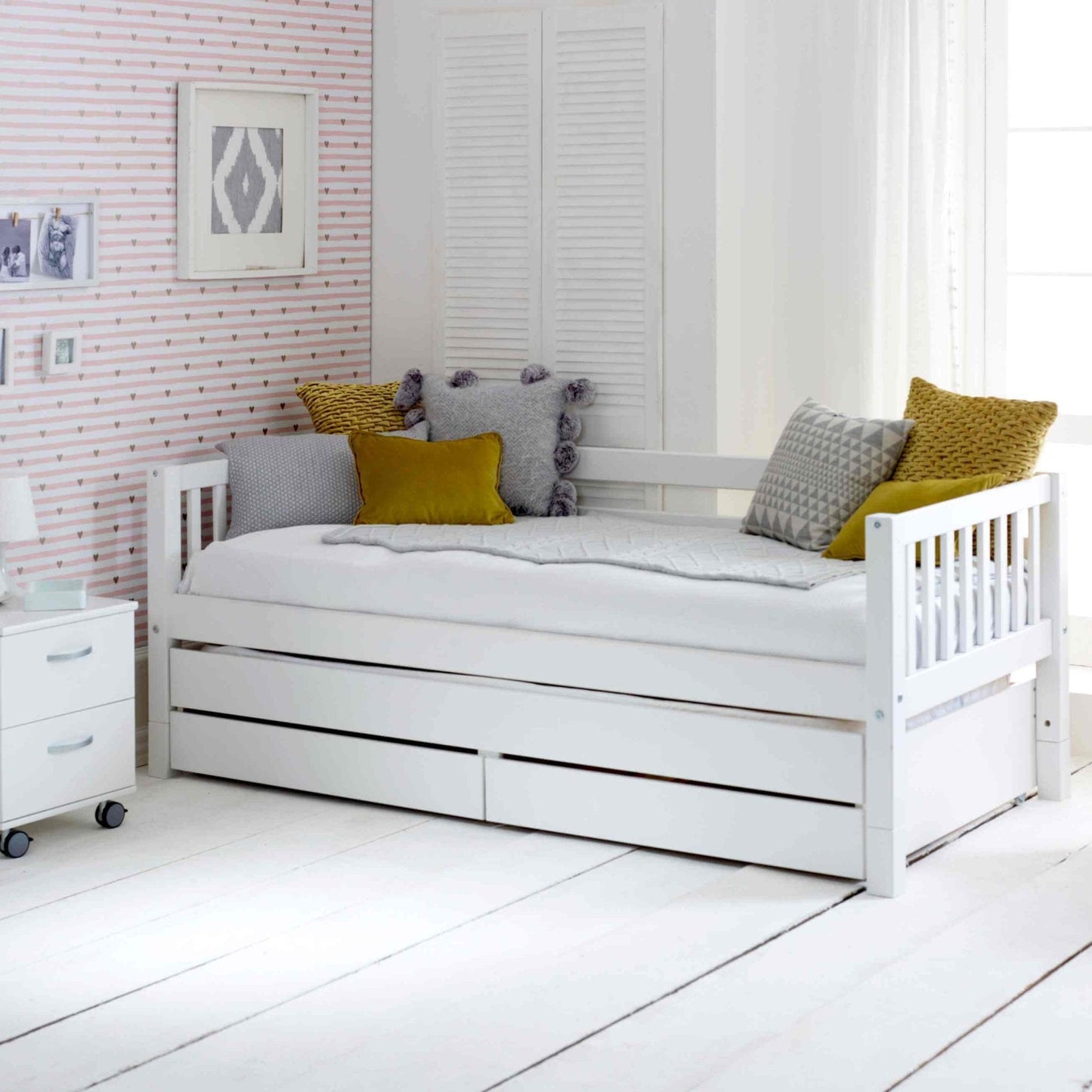 Nordic Daybed with Trundle Pull Out Bed and Storage Drawers in White Room with Cushions