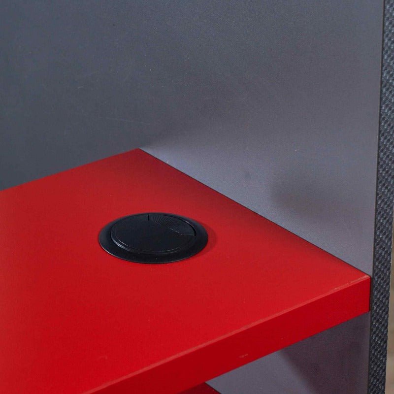 Red desk surface with integrated cable grommet, part of the Loftpod gaming bed setup.